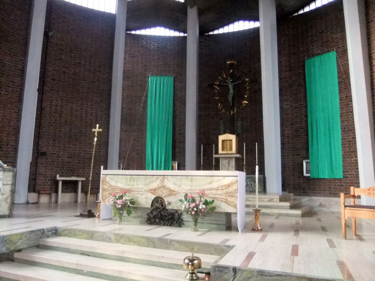 Altar of  St Charles Borromeo Church encircled by a series of concrete columns