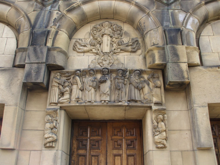 Carved stonework over central entrance of St Columba's Church