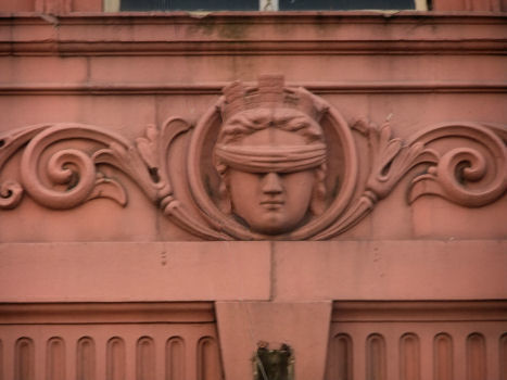 Blind Justice over the entrance of former Police Station