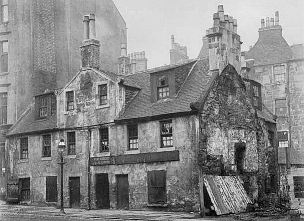 Traditional old house alongside typical Gorbals tenement