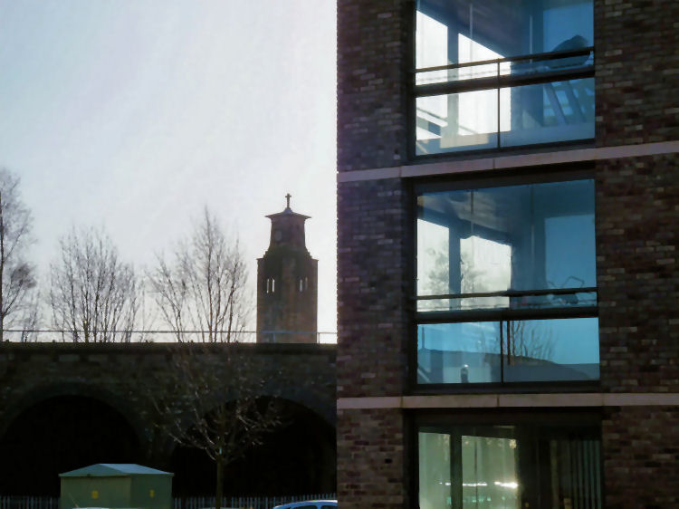 Glimpse of Caledonia Road Church from new housing replacing demolished tower blocks of Stirlingfauld Place 