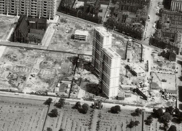 View of St Francis Church and gatehouse of Southern Necropolis surrounded by cleared ground