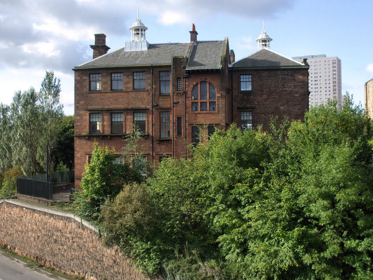 View of east fa�ade of Martyrs School from footbridge over M8 urban motorway
