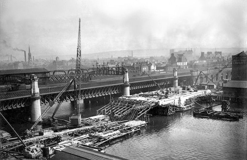 Construction of King George V Bridge with both Bridge Street Stations in the background, 1926 