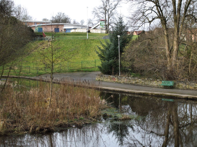 The remains of Castlemilk House on elevated site overlooking Fish Pond