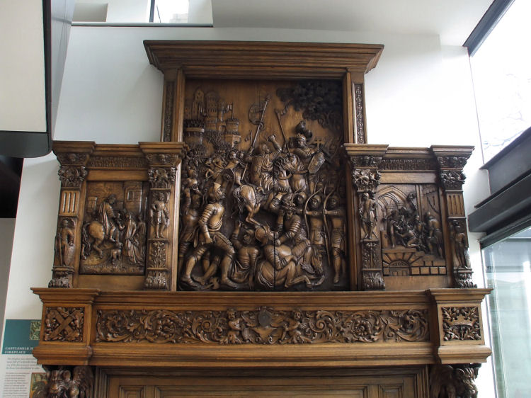 Oak fireplace, recovered from Castlemilk House, depicting the Siege of Orl�ans in 1429