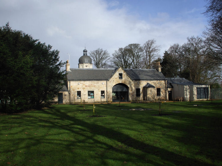 View of stables block from gardens at rear