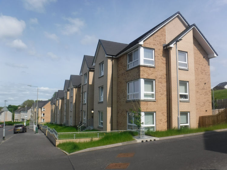New housing in Castlemilk Drive leading down to 1950's blocks, May 2023 