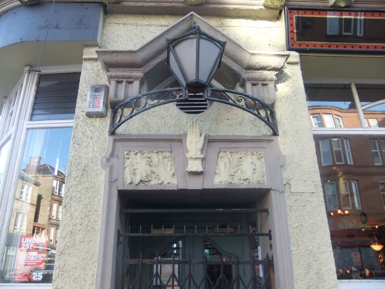 Hand with a cross in the palm at Corona Bar, Crossmyloof