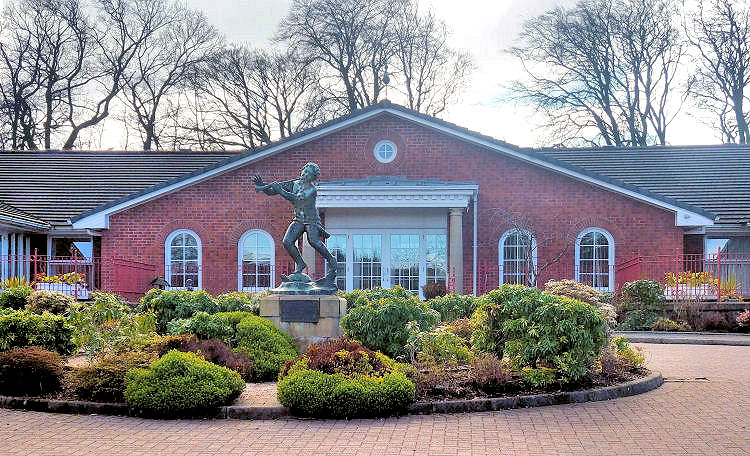 Statue of Peter Pan at entrance to Mearnskirk House, an NHS operated nursing home at former Mearnskirk Hospital