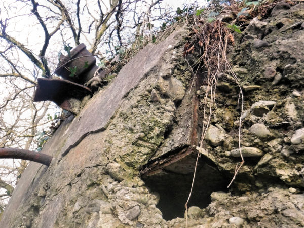 Exposed rusted ironwork from inside abandoned retort, Netherlee, 2017