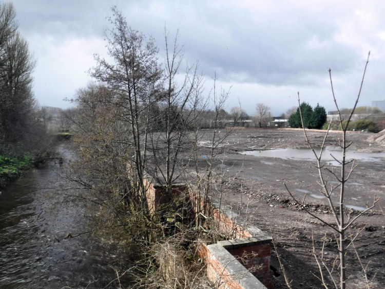 Cleared site of  demolished factories and warehouses at  White Cart Water, Pollokshaws, 2017