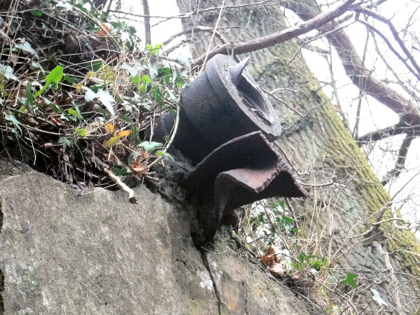 Cast-iron outlet pipe and remains of pipe bridge support at shale oil retort, Netherlee