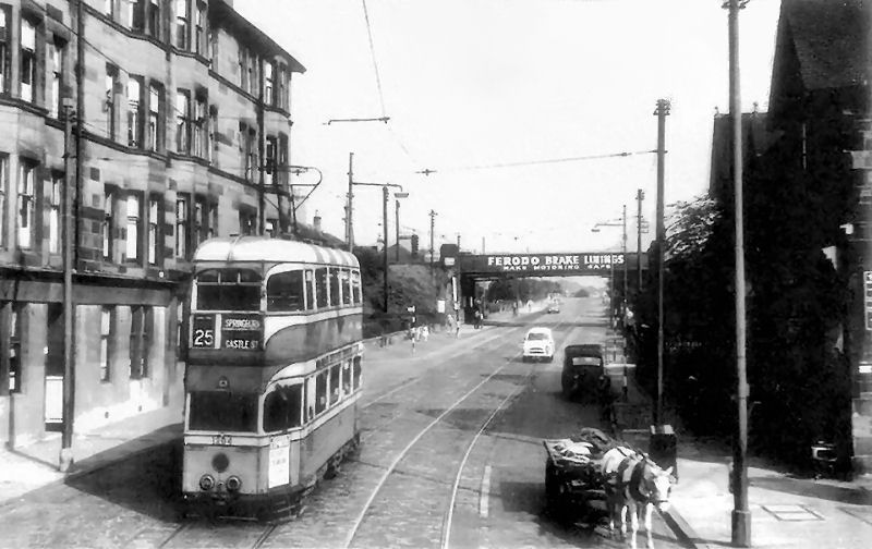No.25 tram on Pollokshaws Road heading towards railway bridge at Shawlands Station