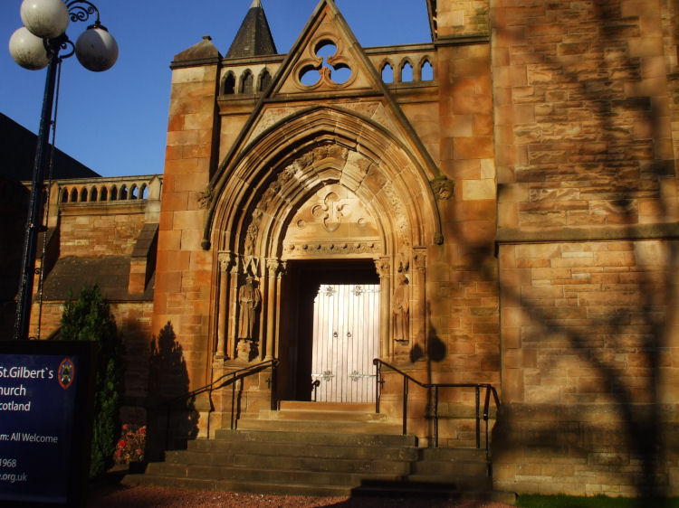 Doorway at Sherbrooke St Gilbert's Church, flanked by carved figures