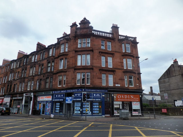 Red sandstone tenement block at corner of Pollokshaws Road and Allison Street