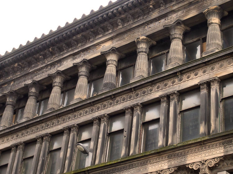 Collonade on top storey of Egyptian Halls showing decaying stonework