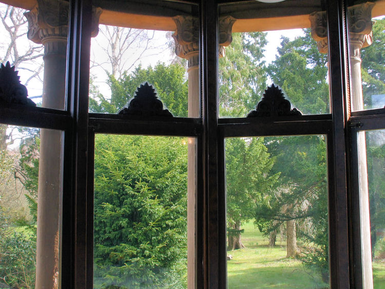 View of gardens from bay window at Holmwood House