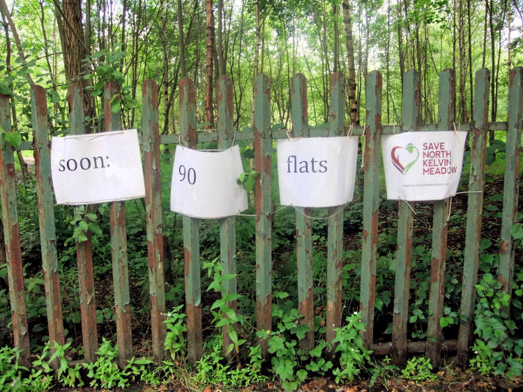 Protest notice on fence at North Kelvin Meadow