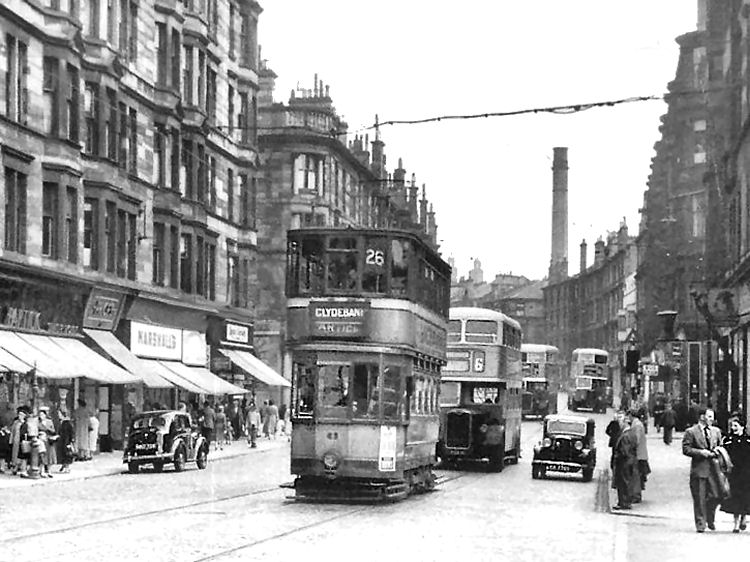 Trams and buses in 1950's view of Dumbarton Road, Partick