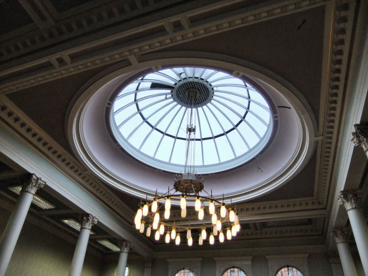 Dome and electric lights illuminating the centre of Woodside Library